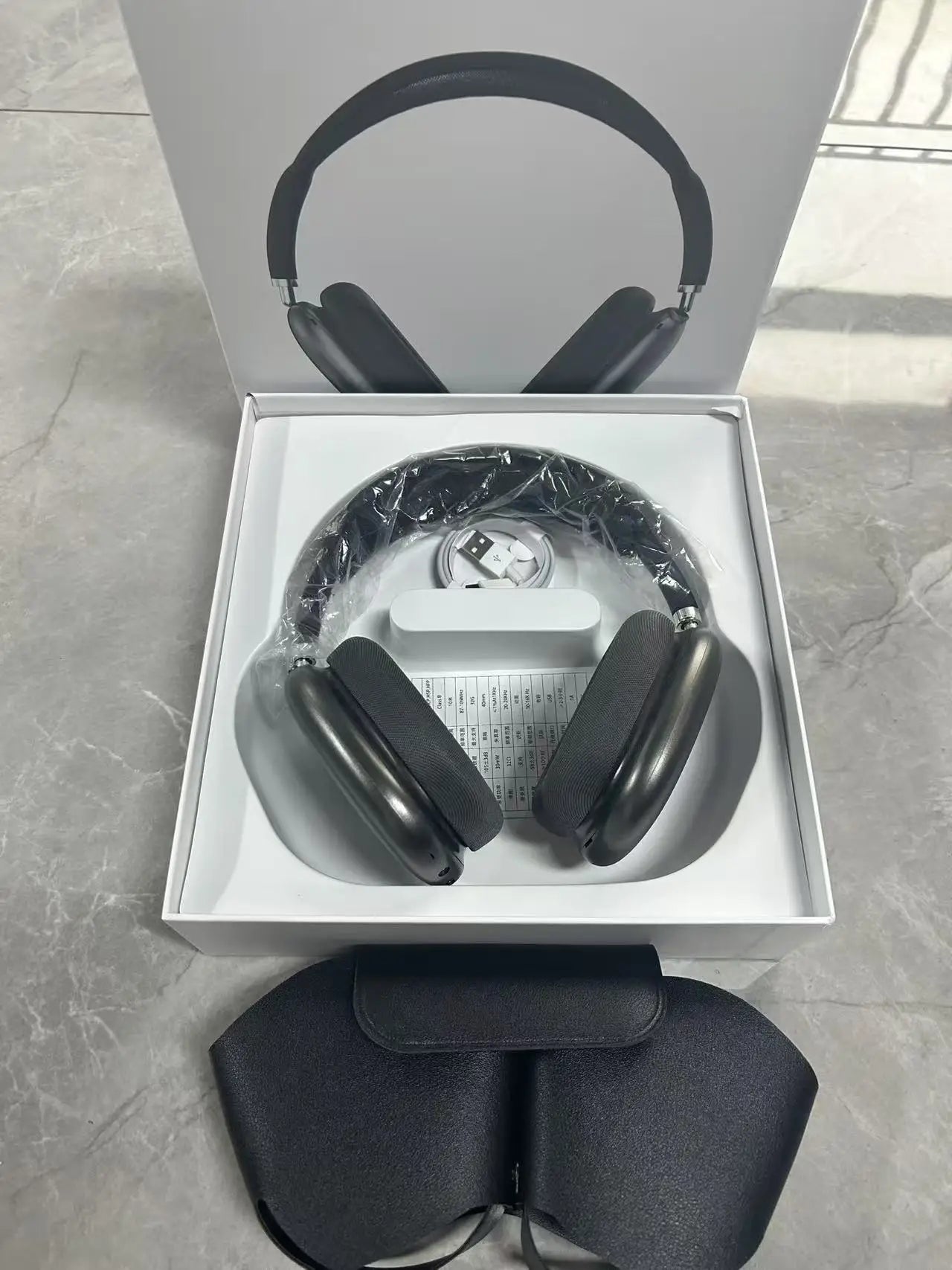 OLDWAY headset with long battery life and noise reduction, displayed in green packaging on a gray surface.