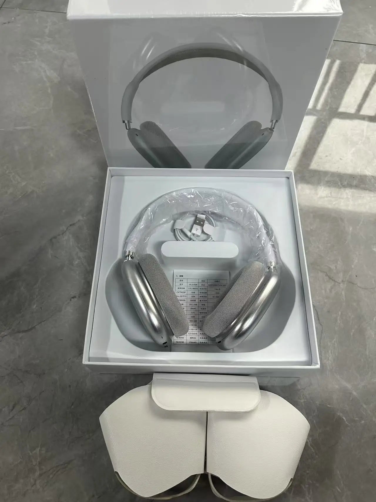 OLDWAY headset with long battery life and noise reduction, displayed in green packaging on a gray surface.