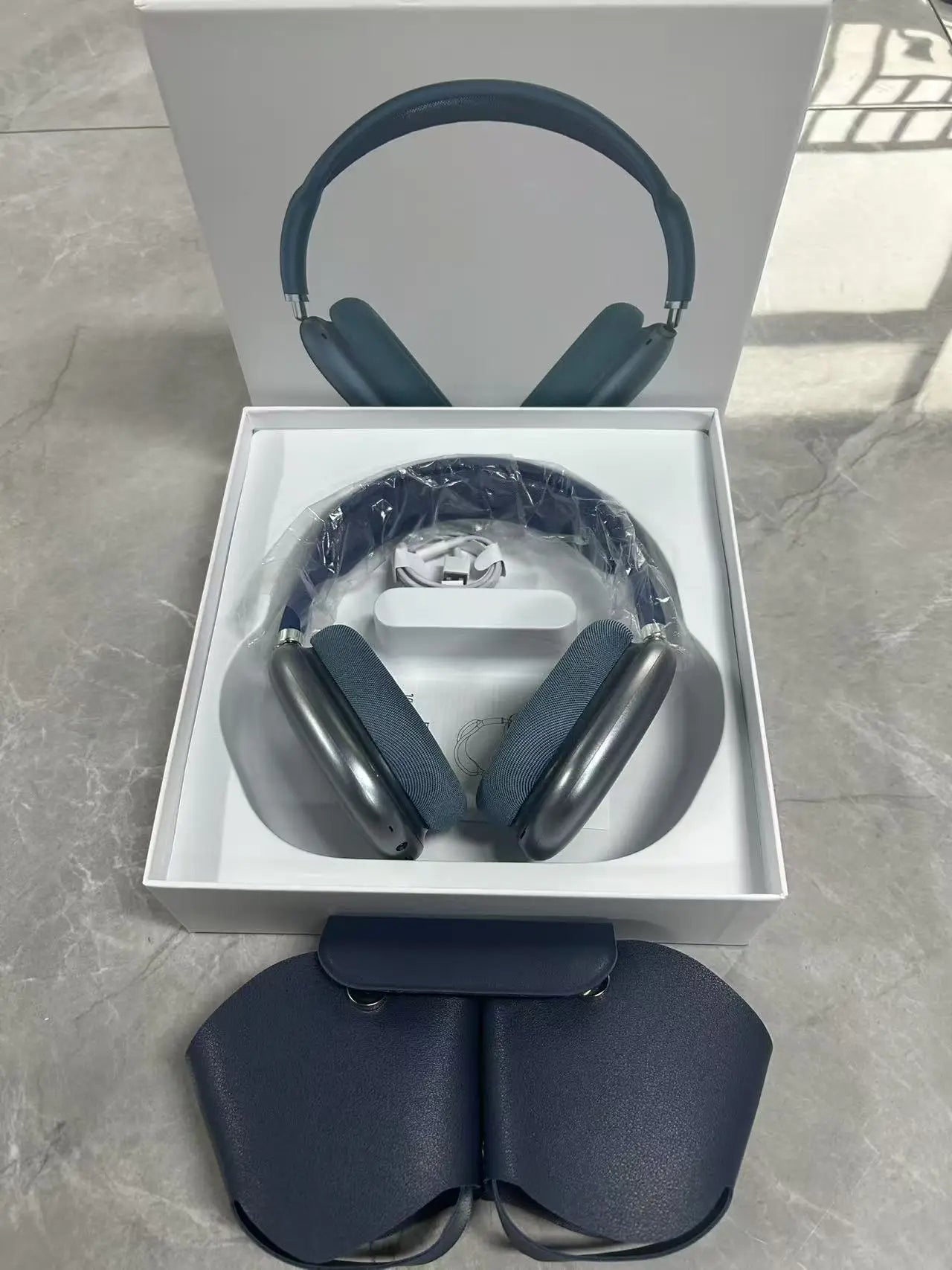OLDWAY headset with long battery life and noise reduction, displayed in green packaging on a gray surface.